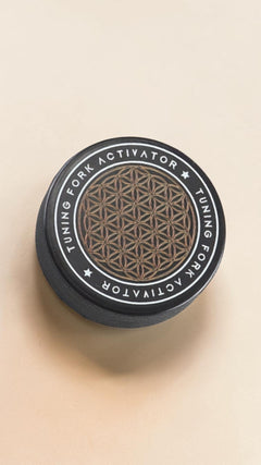 The Humming flower-of-life tuning fork activator puck